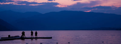 Kids playing on a boat dock in Eastern Washington at dusk